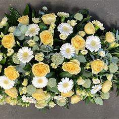 Yellow and white casket spray